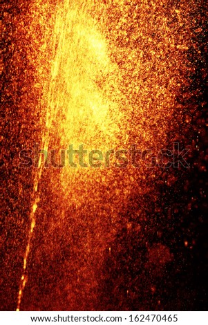 orange sparks on black background