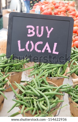 Locally Grown Green Beans and Tomatoes in Brown Baskets For Sale at the Farmers Market
