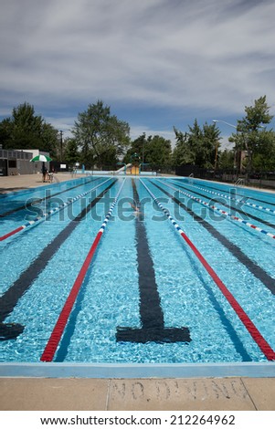 No Diving in Outdoor Pool With Lap Lanes and Female Swimmer