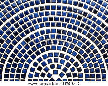 Blue ceramic tiles arranged in a half circle and look like network.