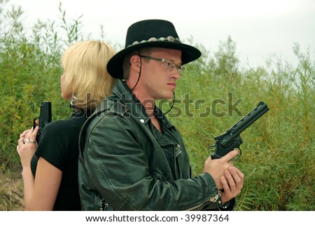 Two people with guns, duel