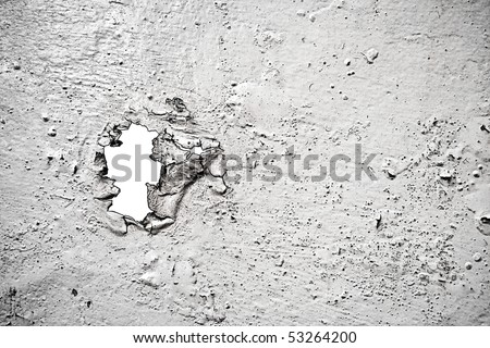 old  painted ruined surface with a hole