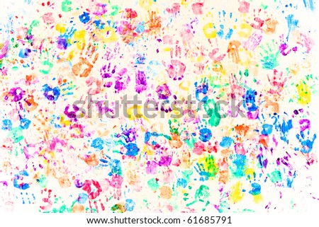 colored painted handprints on white