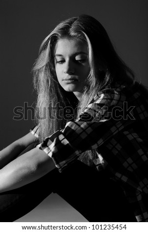 Sad college student. Black and white photography
