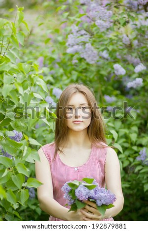 Portrait of a beautiful young woman with long brown hair that morning walks through landmark.