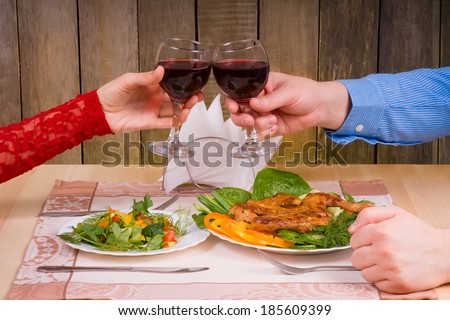 Lovely couple having romantic dinner or lunch in restaurant with rustic interior