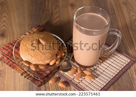 almond cake, almonds and a mug with milk chocolate