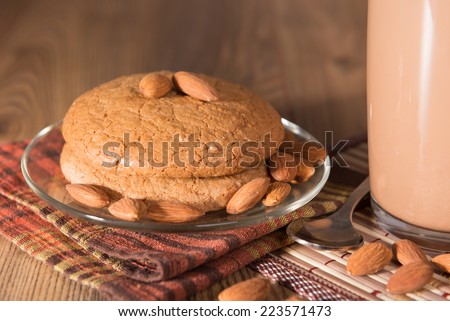 almond cake, almonds and a mug with milk chocolate