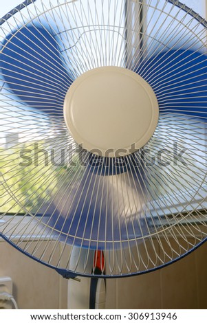 the fan is running near the open window