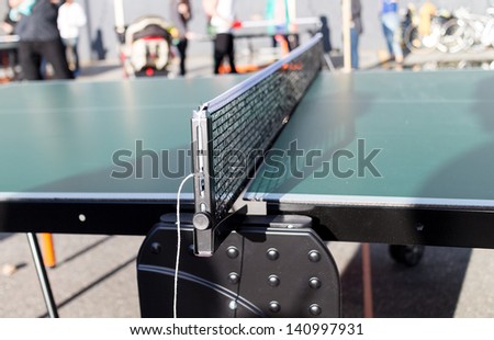a table tennis net at outdoor event