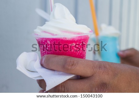 two ice cream floats in plastic cups