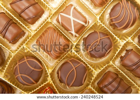 Large box of sweet chokolate candies.