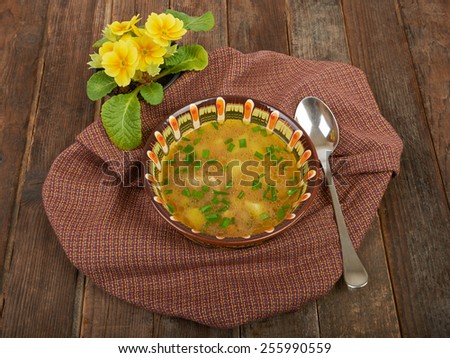 A bowl of hot soup on the table