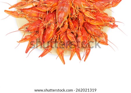 A large dish of boiled crayfish isolated on white background
