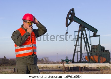 man speaking into the radio station and holding the helmet ,best focus on the man pumped soft focus,