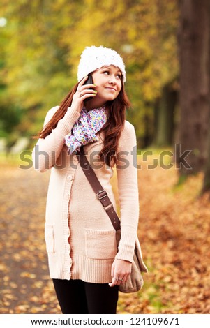 Beautiful young girl talking on cell phone. Beautiful Caucasian Teenager. Attractive young girl.