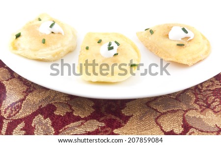Delicious authentic Polish pierogies with Greek Yogurt and chives