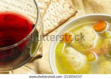 Delicious Matzoh ball soup with crackers wine and dill