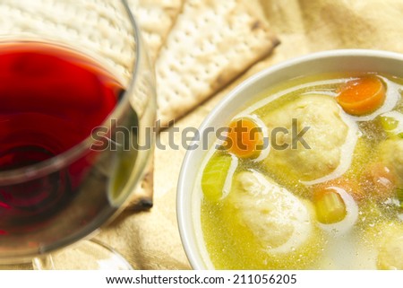 Delicious Matzoh ball soup with crackers wine and dill