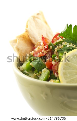 Healthy fresh vegetarian tabbouleh salad with pita chips