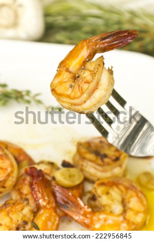 Authentic Portuguese Garlic Shrimp garnished with rosemary and thyme