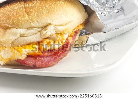 Taylor ham, pork roll, egg and cheese breakfast sandwich on a kaiser roll with salt pepper and ketchup, from New Jersey