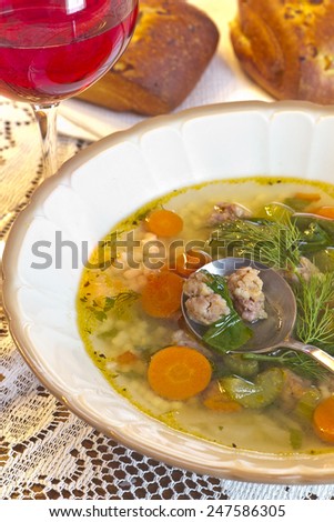 Italian Wedding Soup with fresh baked onion bread, and a glass of red wine