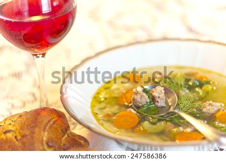 Italian Wedding Soup with fresh baked onion bread, and a glass of red wine