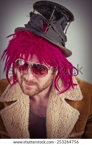 Pink haired bearded bum lunatic man with cool sunglasses