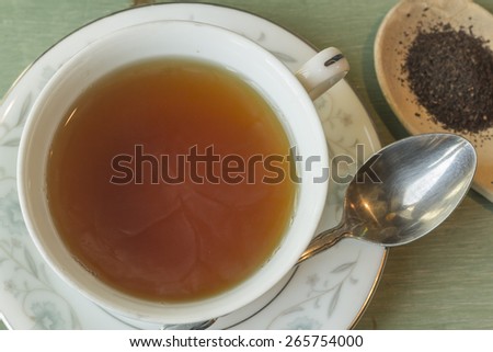 British black tea in a dainty tea cup and saucer