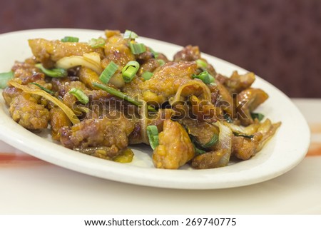 Dining out restaurant Teriyaki chicken with fresh scallions glistens with delicious perfection