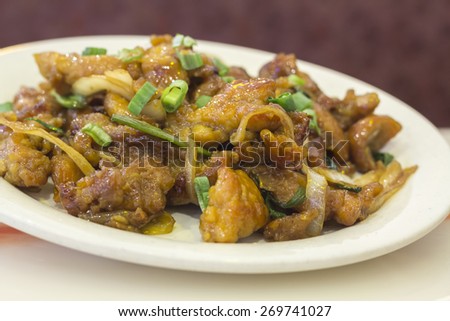 Dining out restaurant Teriyaki chicken with fresh scallions glistens with delicious perfection