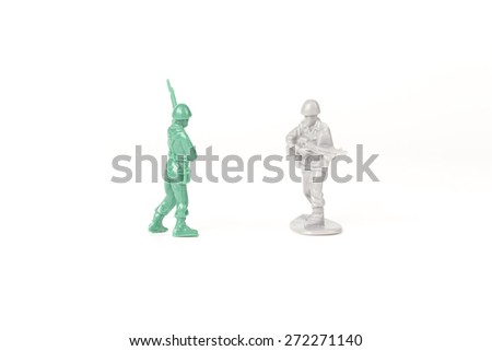 Two different toy army men cross paths
