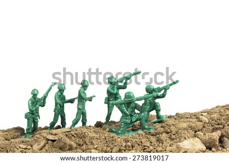 Toy soldiers march along the horizon in war image