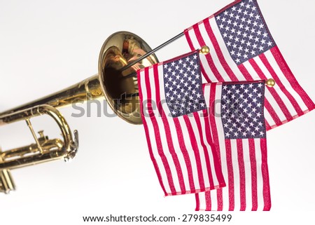 Three American Flags erupt from the bell of a trumpet in patriotism image