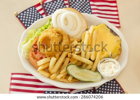 Patriotic American flag Hamburger with cheese fries and just about everything