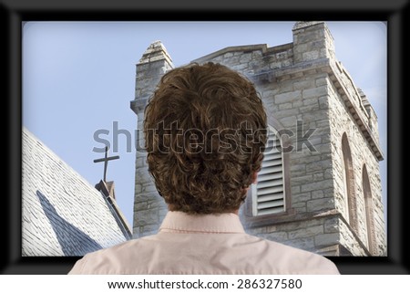 Back of man\'s head as he\'s watching flat screen television