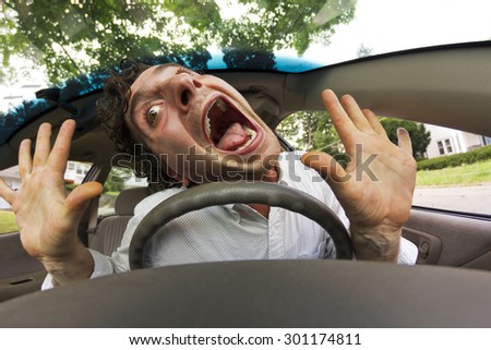 Silly man gets into car crash and makes ridiculous face