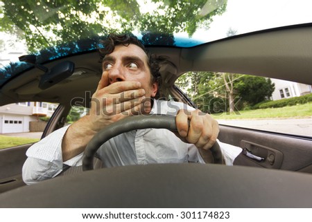 Silly man gets into car crash and makes ridiculous face