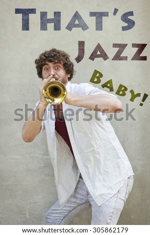 Curly haired man plays jazz trumpet outside