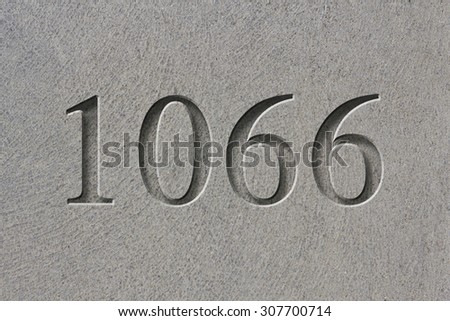 Historical year engraving 1066 on textured old surface