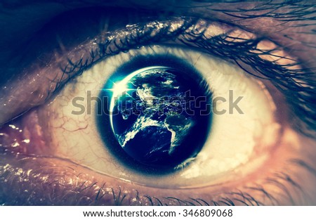 Planet earth reflects in a macro close of a mans eye, Elements of photo furnished from NASA