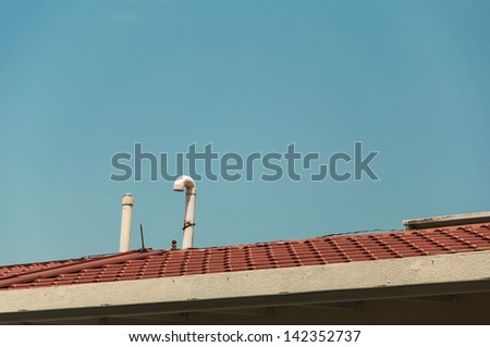 Exhaust pipe and ventilation on top of the house