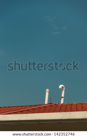 Exhaust pipe and ventilation on top of the house