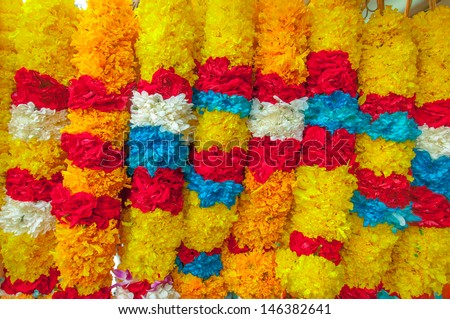 Red Rose Yellow Marigold Flower white jasmine Blue flower Garland in Market for offering in temple