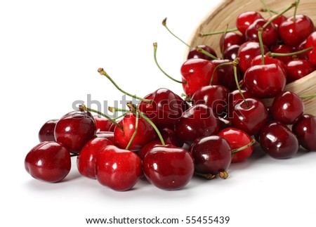 cherries spilling out from the bowl