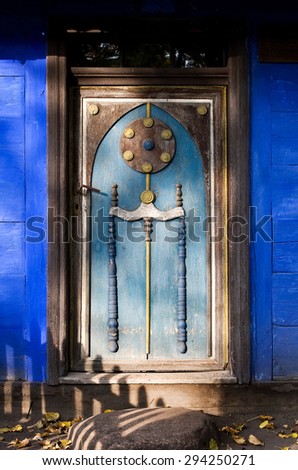 Old wooden door of a traditional house in ?owicz,\
National Village Museum in ?owicz, Poland, Europe