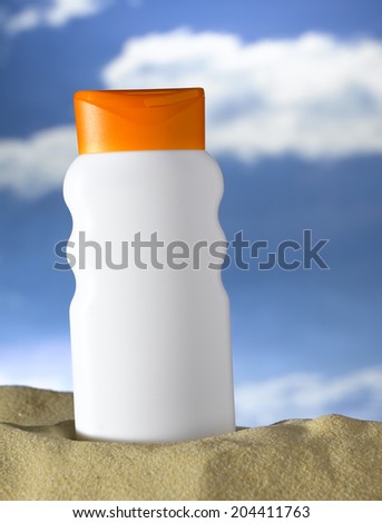 Lotion bottle on a beach