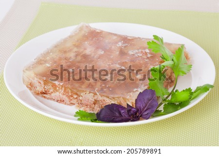 meat jelly with basil on a plate
