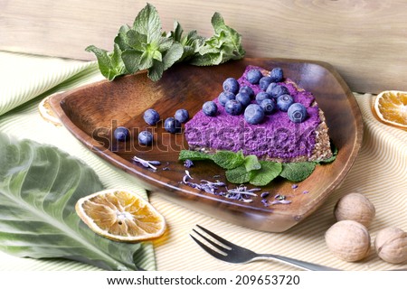 blueberry pie, raw food, with fresh berries in a still life